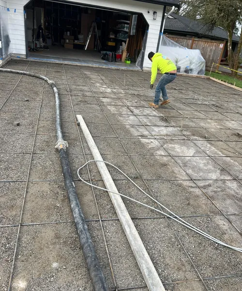 Broom Finish Driveway Replacement With Decorative Borders in Newcastle 